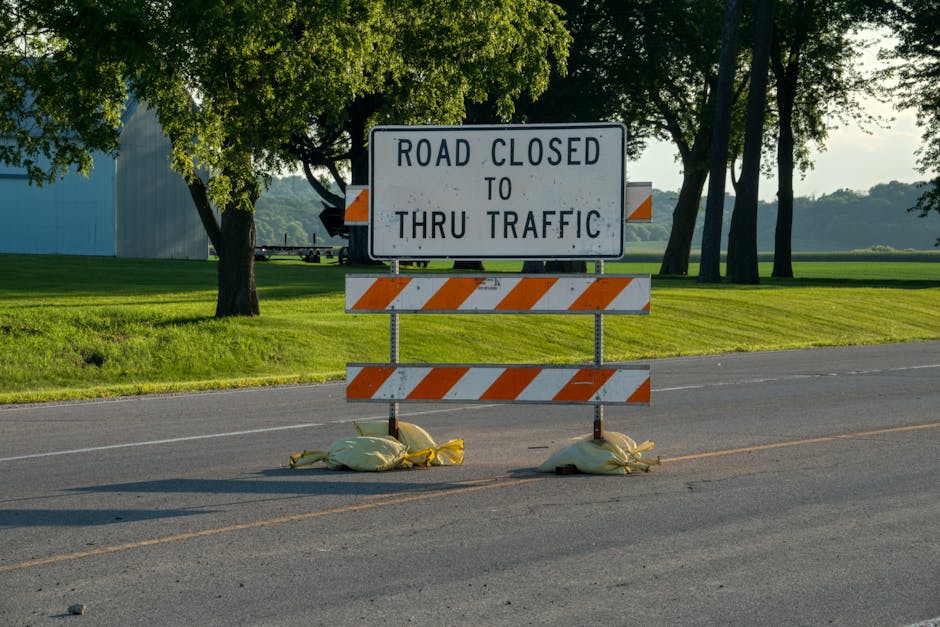 A road closure sign blocks traffic on a rural road in Plainview, Minnesota.